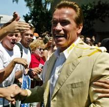 SchwarzenEGGer: Candidate Arnold takes an Egging in Long Beach from someone presumably not a fan... but with EGGs to spare!